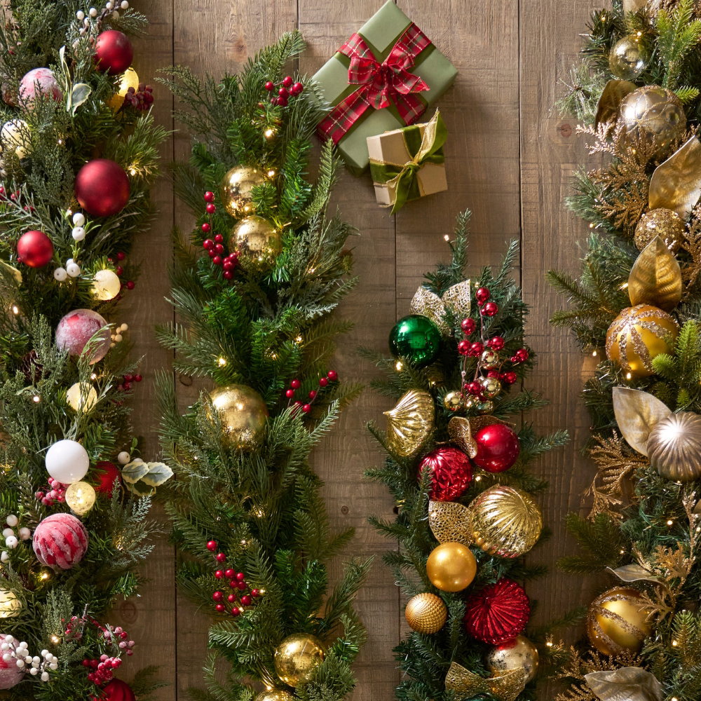 Holiday garlands decorated with red and gold ornaments 