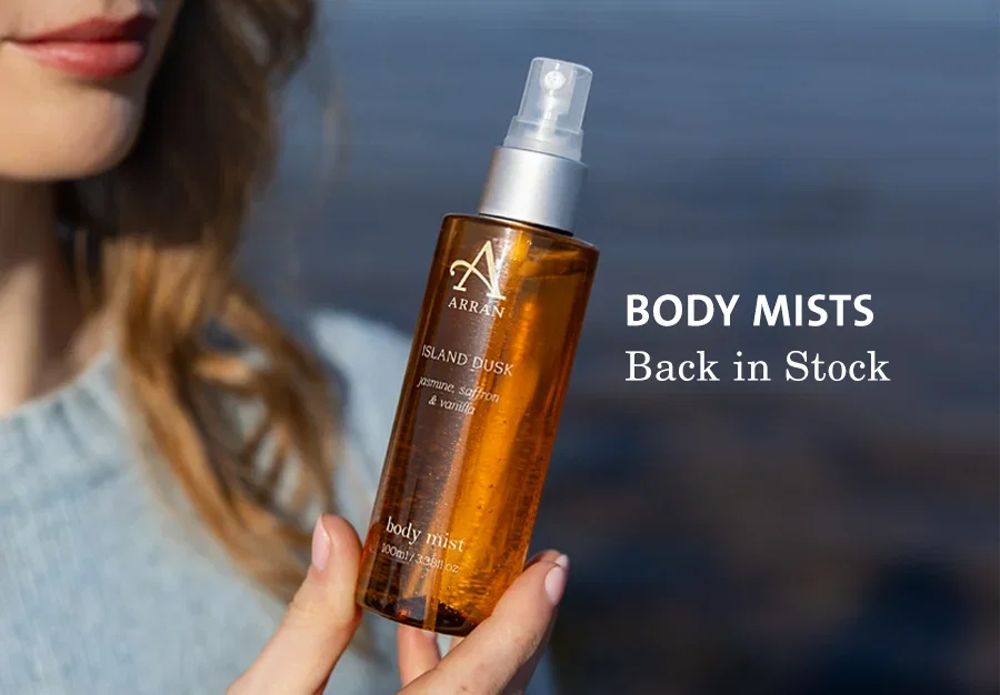 model holding an island dusk body mist