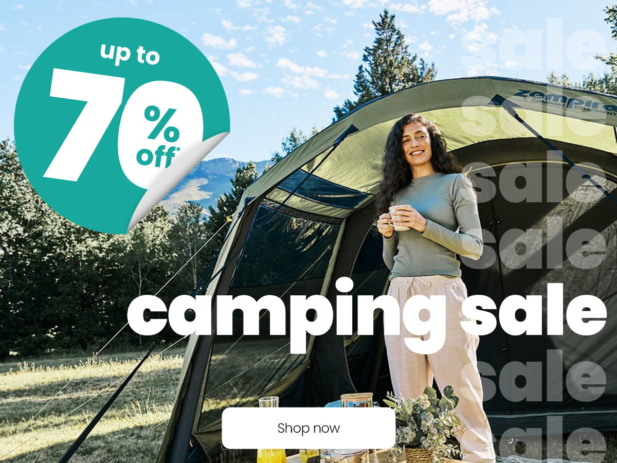 Camping sale banner showing a person standing beside a large tent outdoors, with text “Camping sale” and “Up to 70% off”.