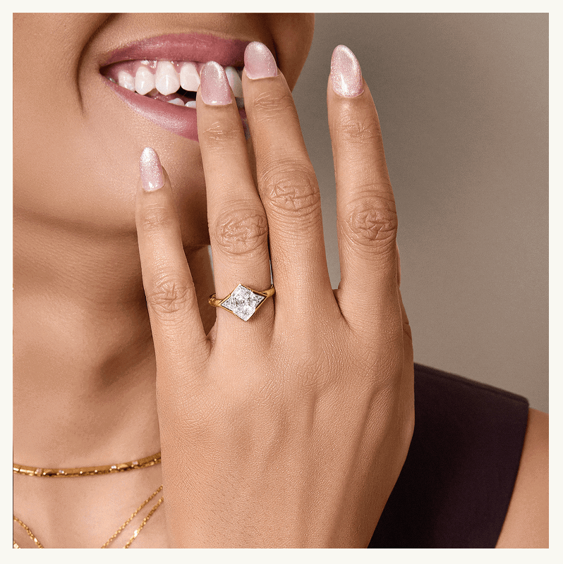 Focus on unique diamond-center stone, set on gold ring band. 