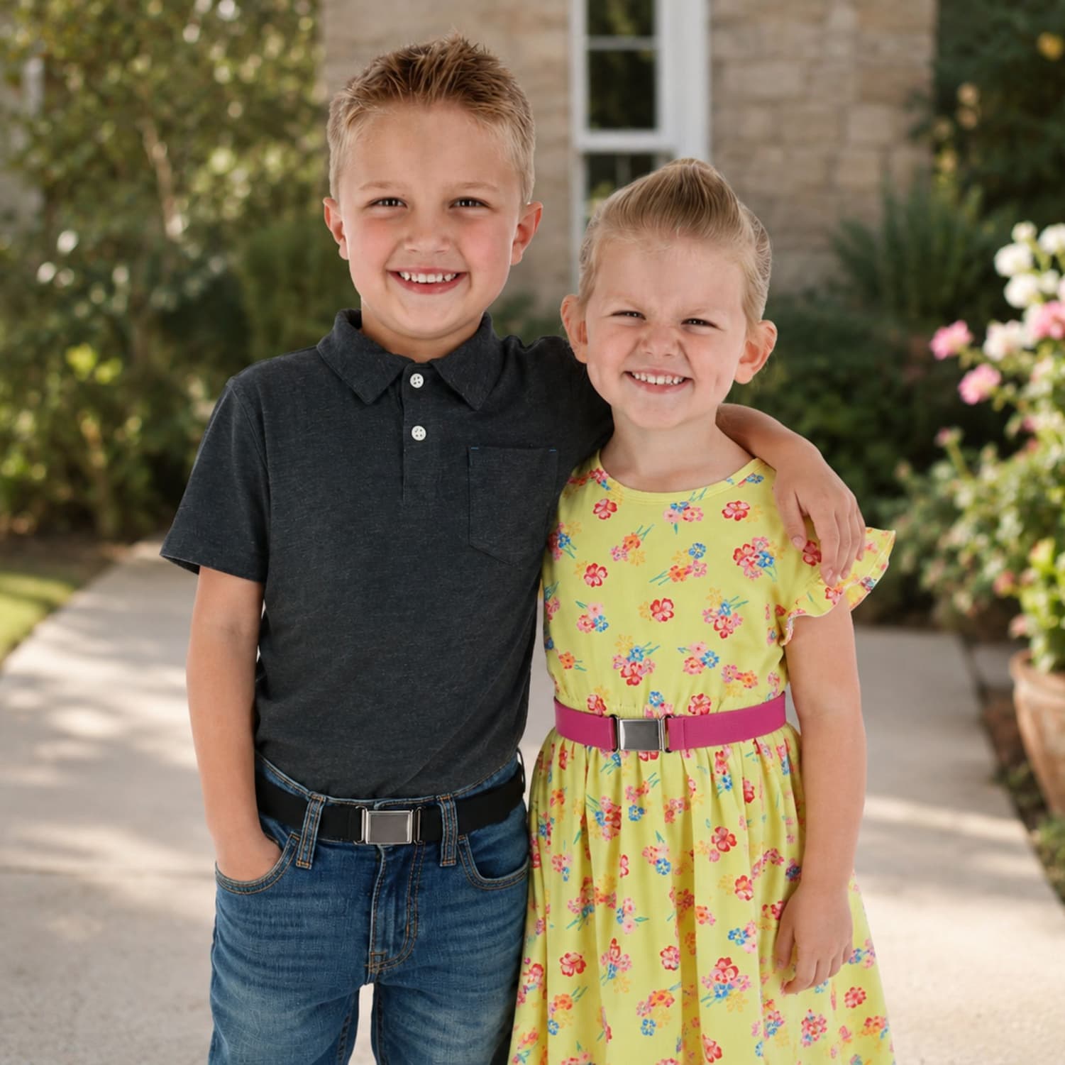 Two kids wearing belts