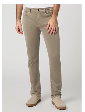 A man's legs wearing light tan corduroy pants.