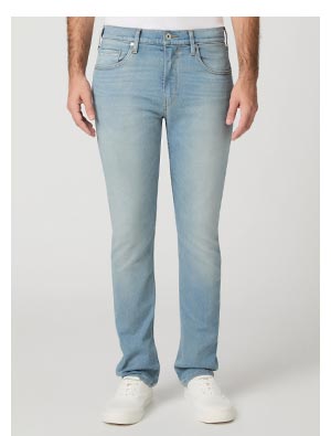 A man wearing light blue wash denim jeans.