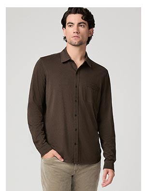 A man wearing a dark brown button up shirt.