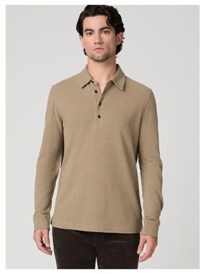 A man wearing a tan long sleeve knit polo.