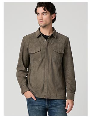 A man wearing a dark earthy grey brown suede button front shacket.