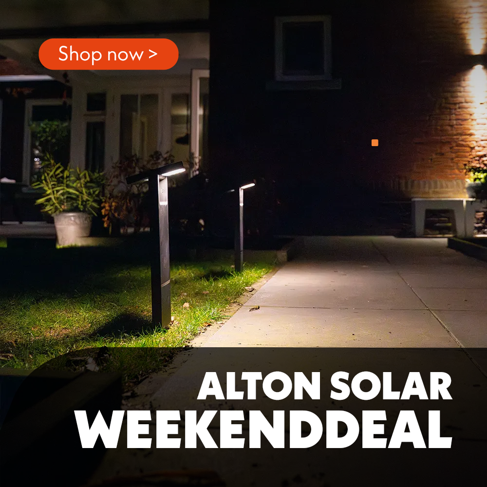 Two Alton solar LED path lights illuminate a modern garden path at a residential property in the evening. The solar lights emit a warm white light, providing atmospheric and safe lighting for the garden path. As they are powered by solar energy, the lights can be installed very easily without the need for an electrical connection.