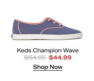 A side view of the Keds Champion Point Low Wave Nautical Chambray Lace-Up in blue with neon coral binding which was $64.95 and is now $44.99 for a limited time. Shop Now.