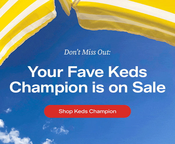 A blue summer sky background with a peek of a yellow-and-white striped beach umbrella at the top. Text overlaid on the background says Don’t Miss Out: Your Fave Keds Champion is on Sale. Shop Keds Champion.