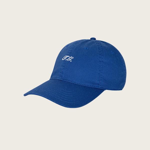The Baseball Hat in cobalt by THE GREAT. SU26 features “T.G.” embroidered in white on the front and is shown against a plain white background.