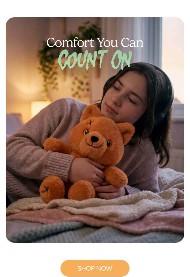 A teen hugging Scary Cute Fox Warmies. Shop Now.