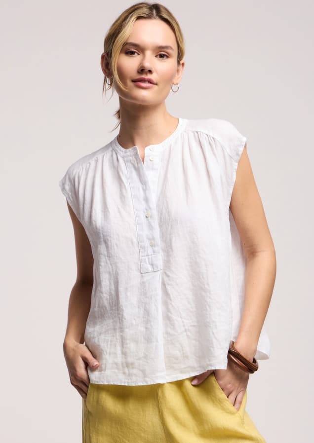 Image shows a model wearing the Bec Top in White.