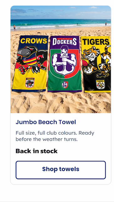A group of Jumbo AFL Beach Towels Sitting on sand at a beach