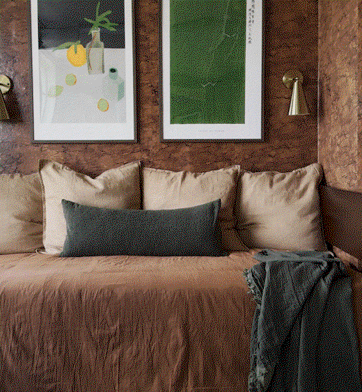 Gif image showing Tempaper's Etched with Time wallpaper by Jeremiah Brent in a dorm room.