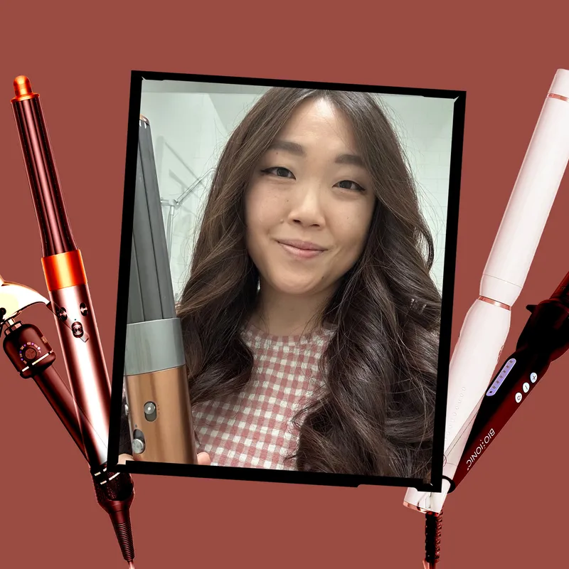 Image contains an Allure editor with the Dyson Airwrap surrounded by a collage of the best curling irons on a brown-ish red background