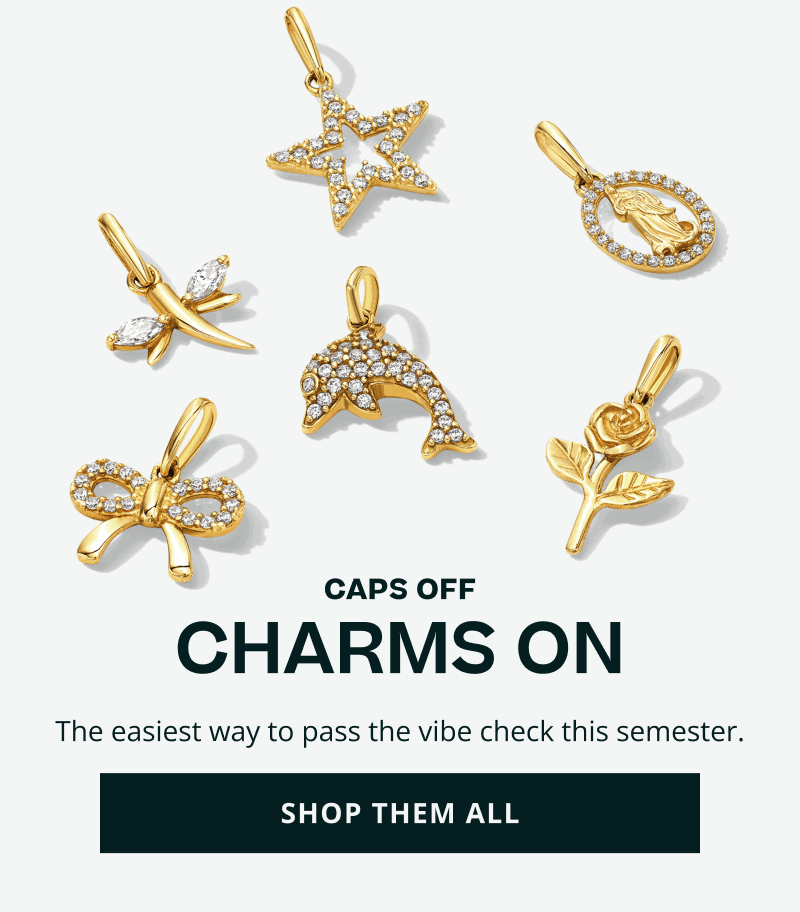 Assortment of gold-set & diamond charms including rose, star & ribbon motifs. Caps off & charms on. Pass the vibe check. Click here to shop them all.