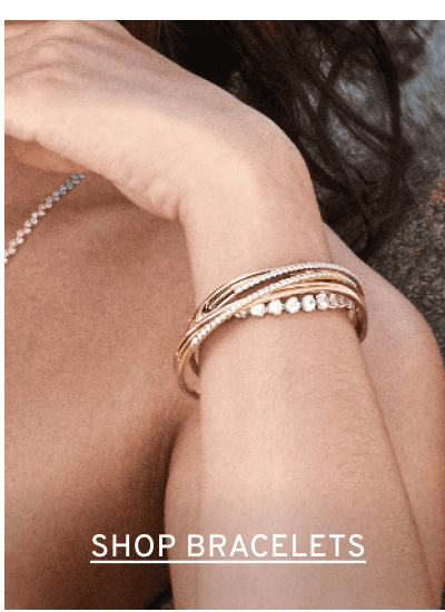 Diamond accent bracelets on woman’s wrist. Click to Shop Bracelets
