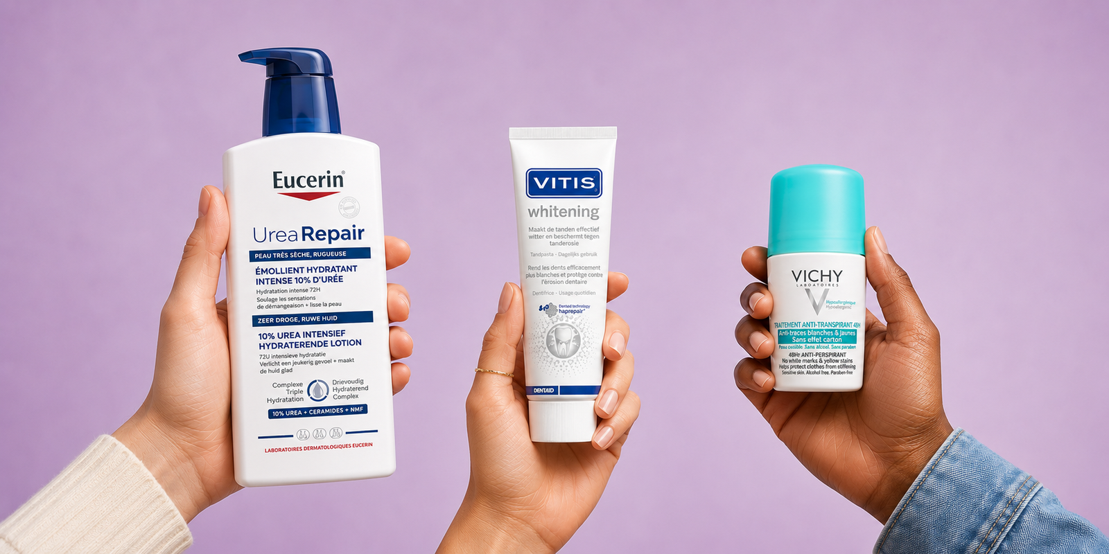 Three hands holding skincare and oral-care products: Eucerin UreaRepair lotion, VITIS Whitening toothpaste tube and Vichy roll-on deodorant on a lilac background
