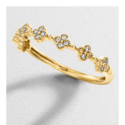 Yellow gold ring with diamond cluster flowers on band.