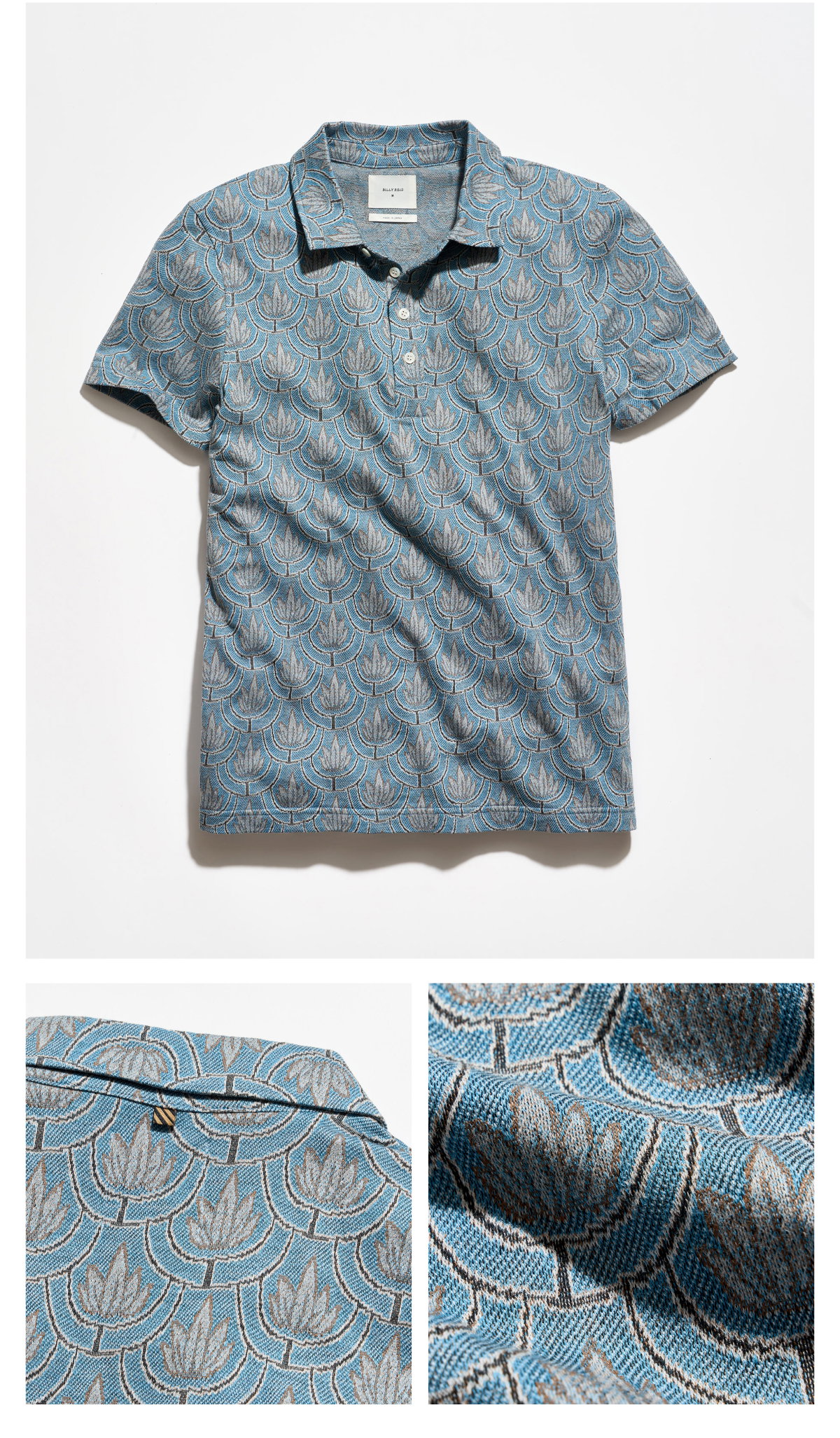 The Numajiri Andrews Floral Polo is pictured in Heritage Blue with a contrasting grey art deco style floral pattern. 