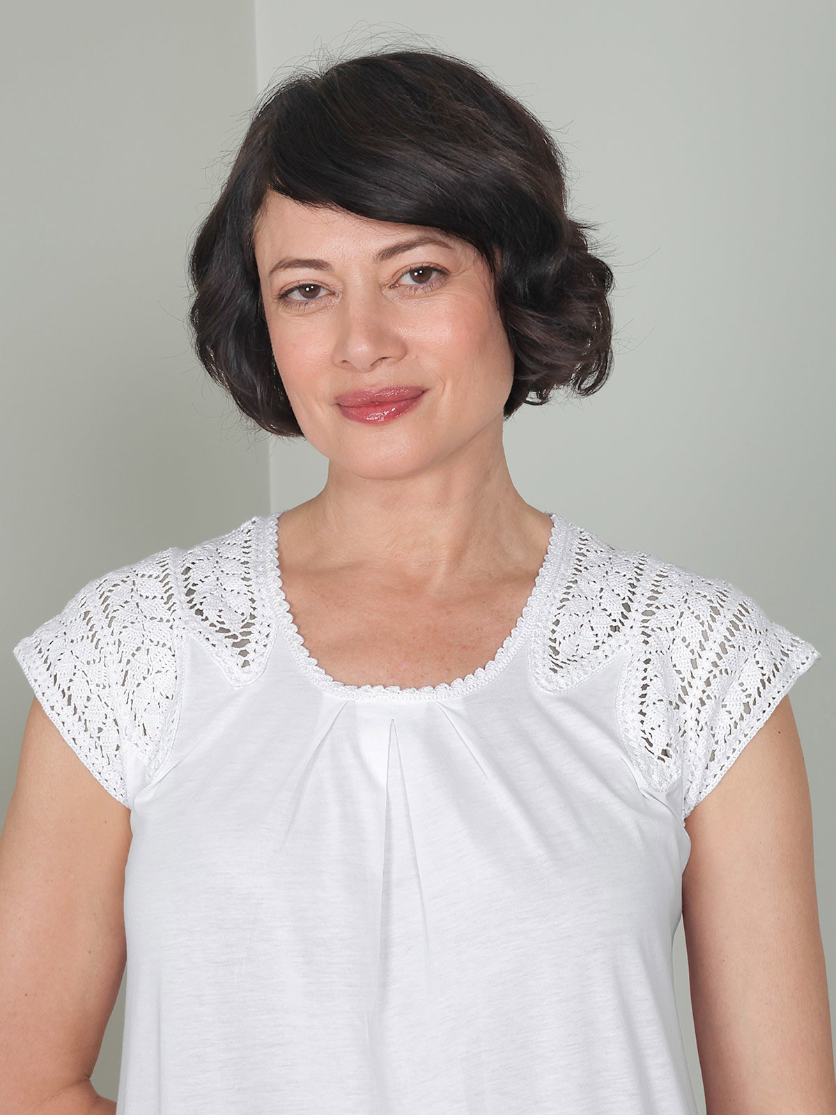 Louise Nightgown This White pima cotton nightgown drapes elegantly for a restful night. The exquisite artisanal sophistication of hand-crocheted detailing adorns the shoulders. Made in Peru.