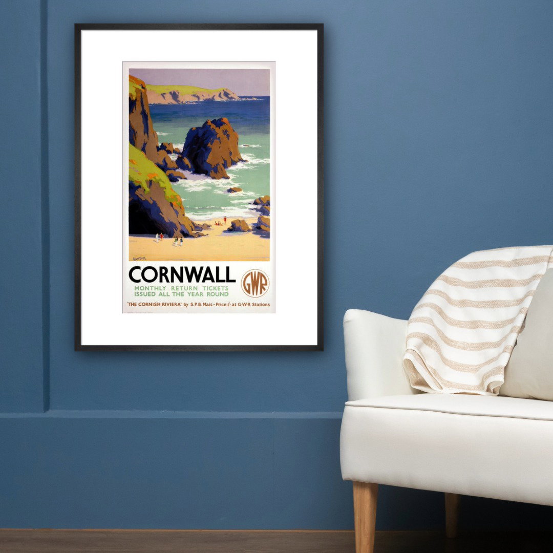 Blue room with white chair and GWR Cornwall poster