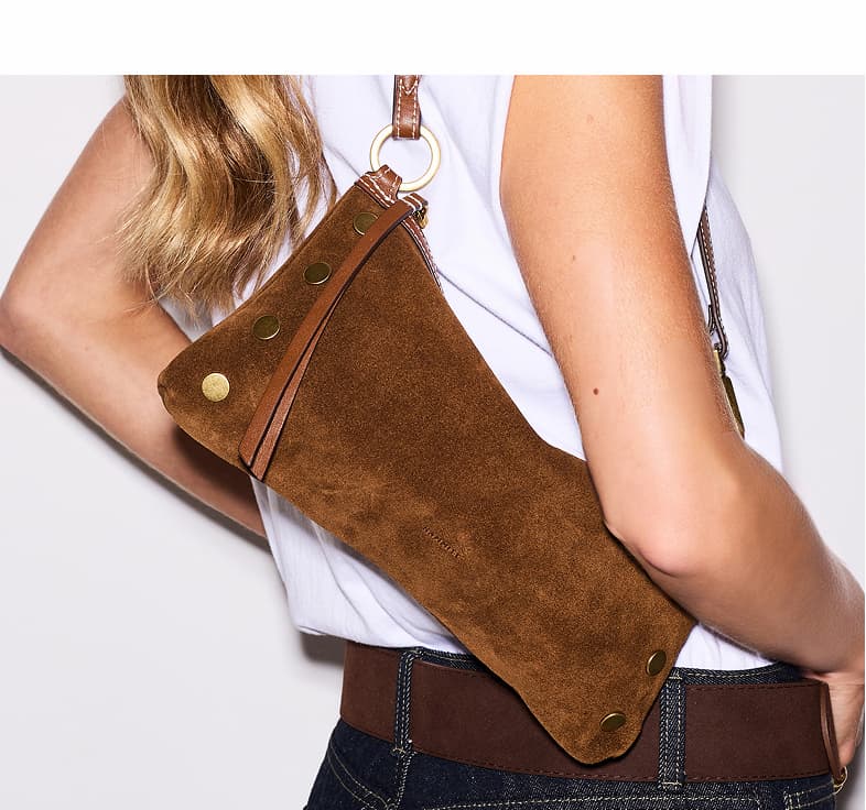 Back view of the Hammitt Kyle Sml in Cinnamon Suede, highlighting velvety Italian suede, leather trim, signature rivets, brushed gold hardware, and the slim shoulder strap.