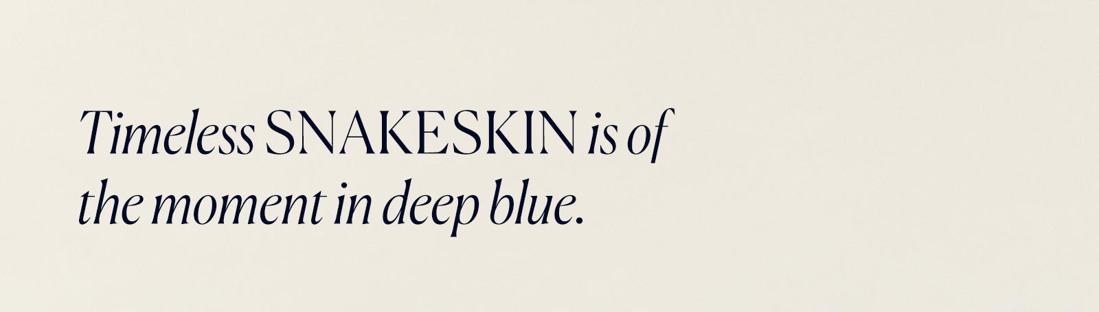 Timeless snakeskin is of the moment in deep blue.