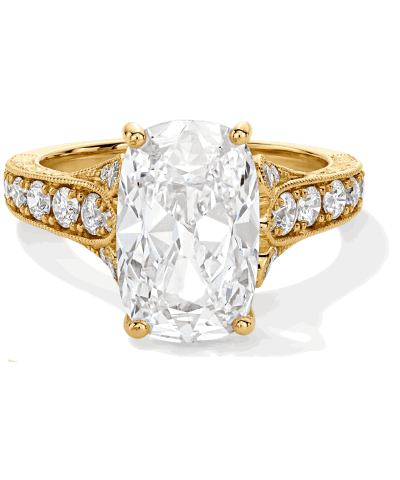 Yellow gold cushion-cut engagement ring, with four-prong setting and diamonds along the band.