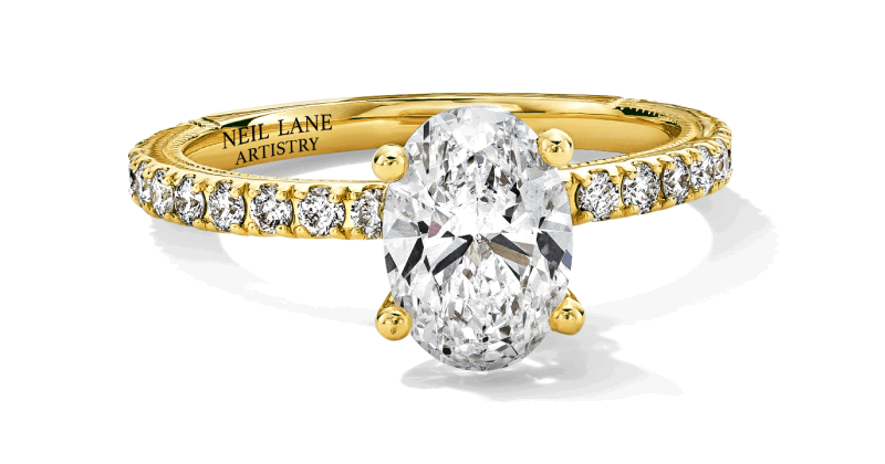 A round diamond engagement ring with marquise and round diamond accents.