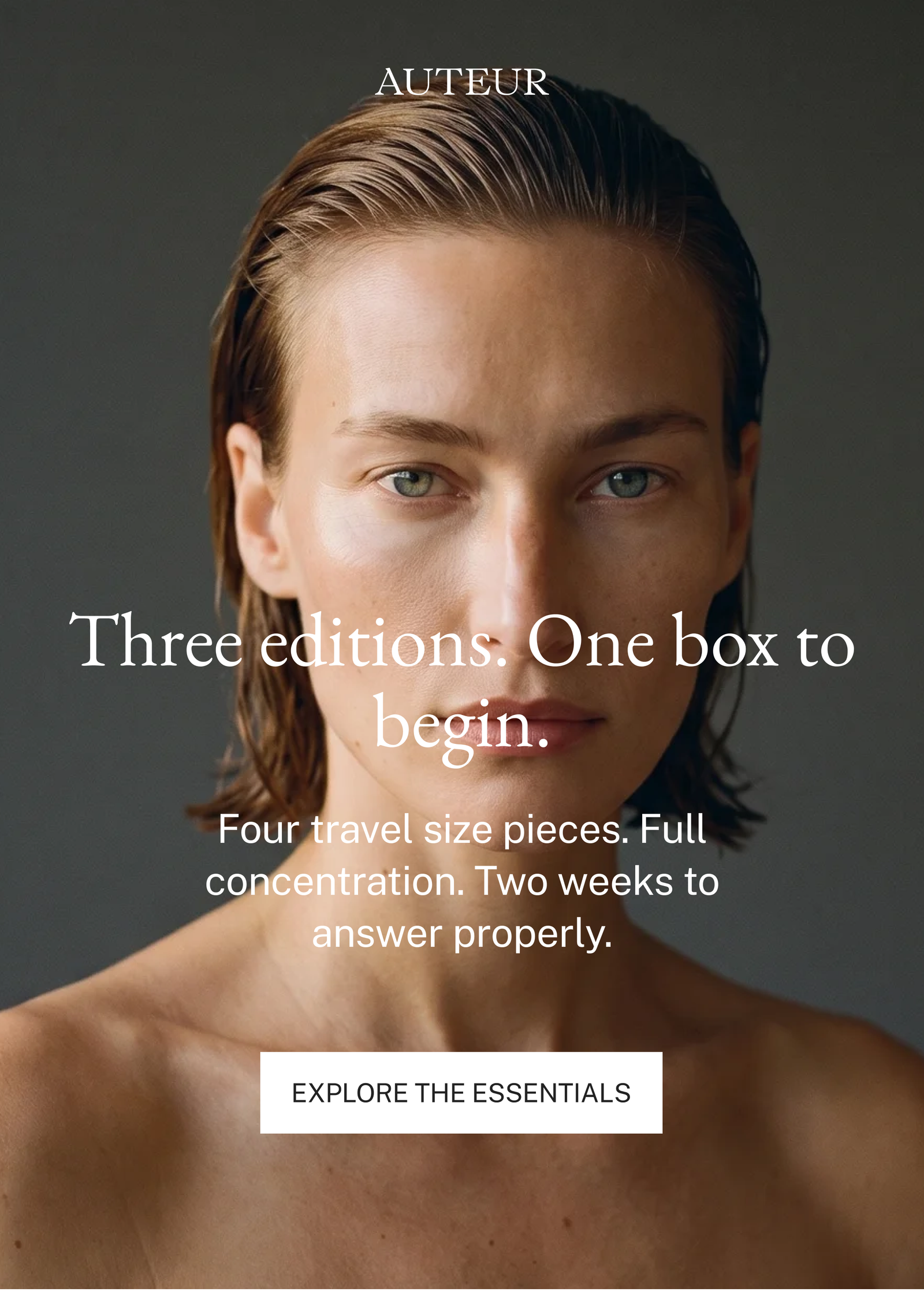 AUTEUR Journey Discovery Kit hero — dark editorial portrait close-up with headline 'Three editions. One box to begin.' and button 'Explore the Essentials'