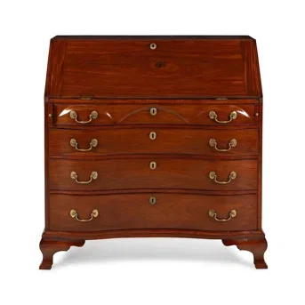 A Chippendale Walnut Serpentine Slant-Front Bureau