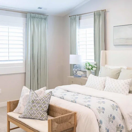 Finished custom curtains styled in a bedroom