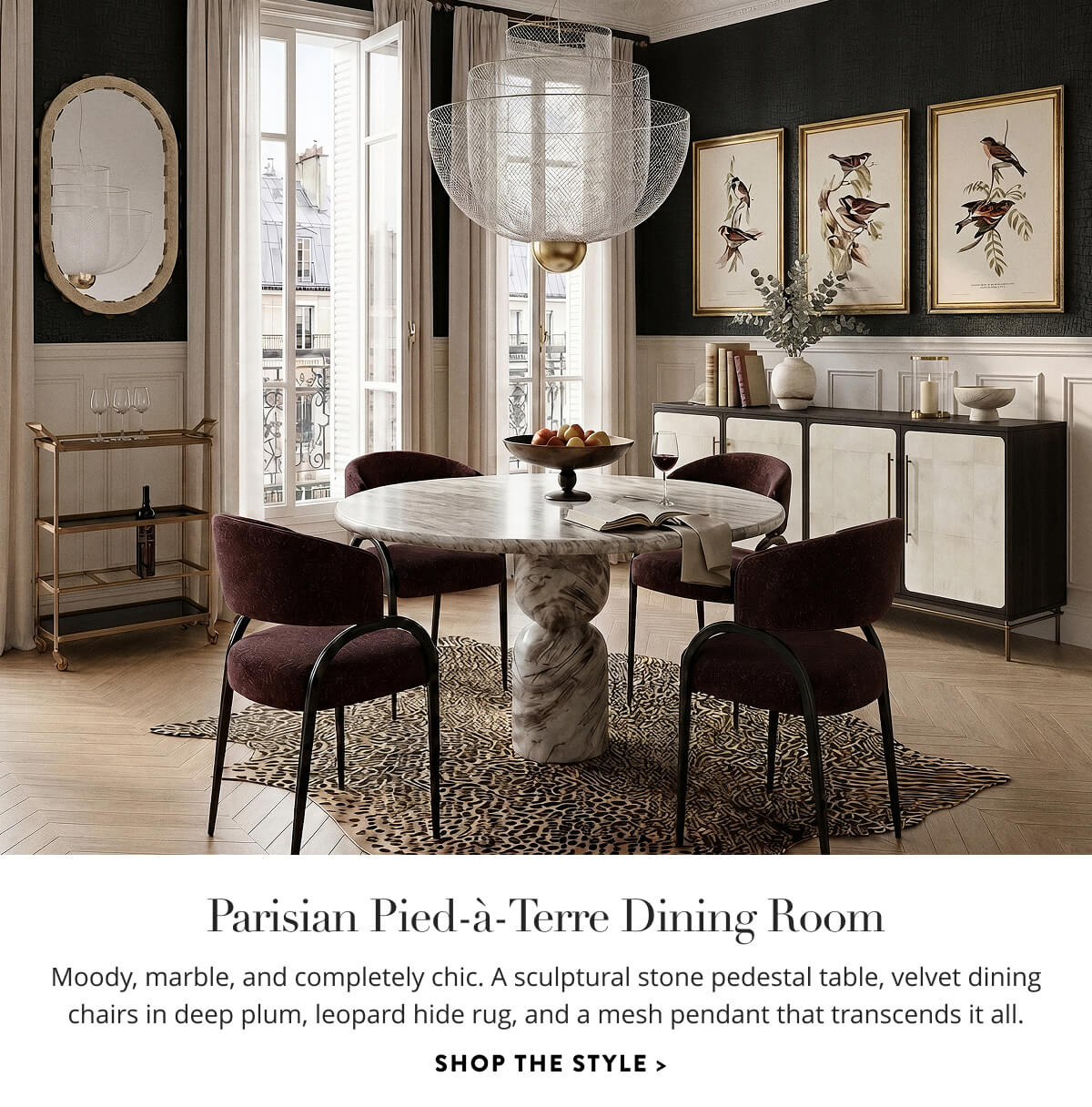 Parisian Pied-à-Terre Dining Room: Moody, marble, and completely chic. A sculptural stone pedestal table, velvet dining chairs in deep plum, leopard hide rug, and a mesh pendant that transcends it all. Shop the style.