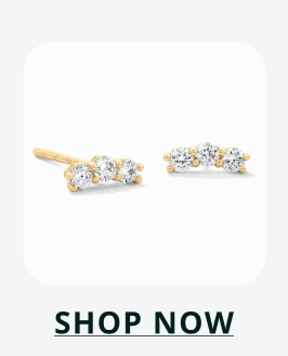 Gold-tone bar stud earrings featuring a row of clear pavé stones. Click here to shop now
