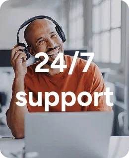 Person wearing headphones at a laptop