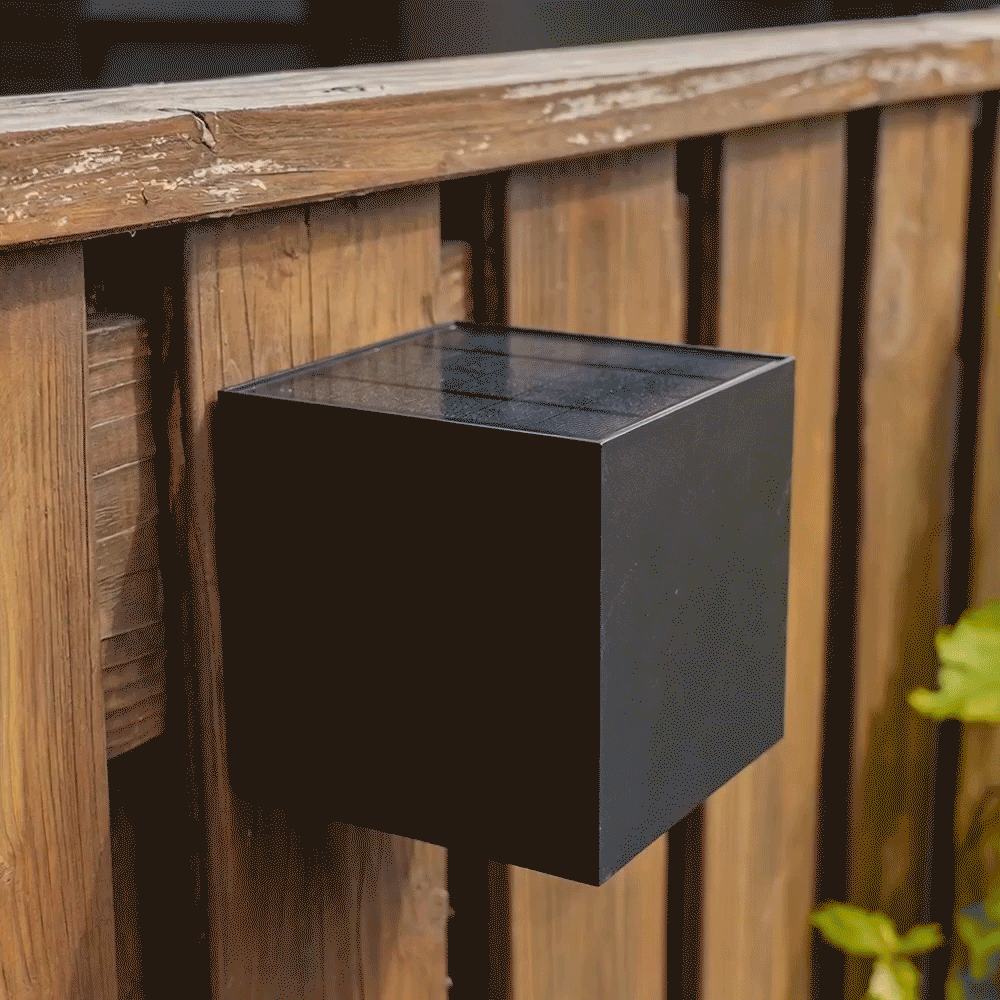 GIF showing fence lighting in daylight and in the dark.