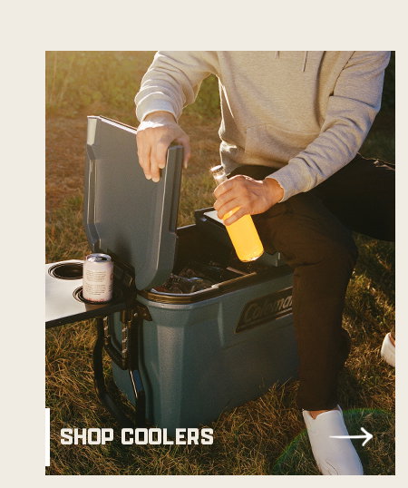 Person opening a cooler, placing a bottle inside with text shop coolers and an arrow button.