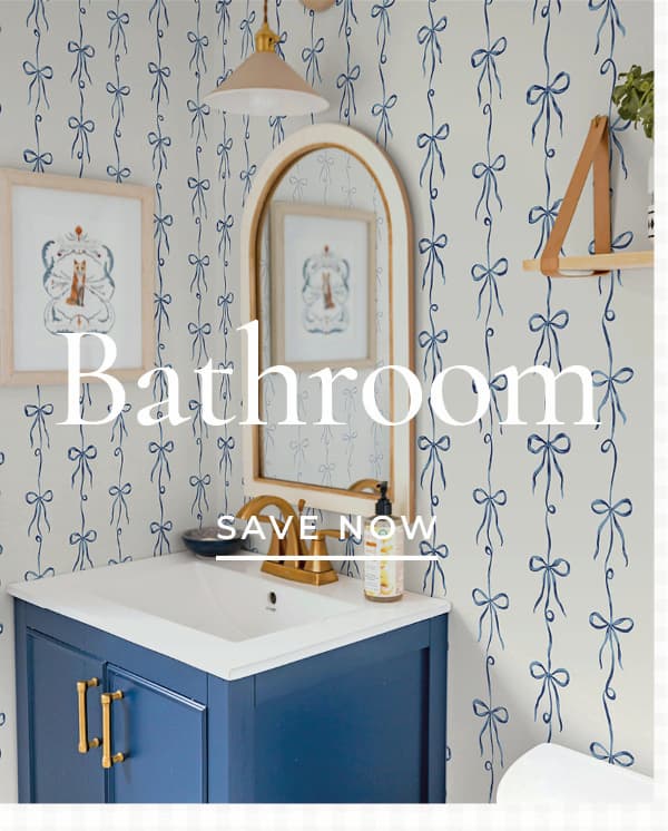 Image of Tempaper's Bow Ties wallpaper in blue installed in a bathroom with a text overlay of "Bathroom Save Now". 
