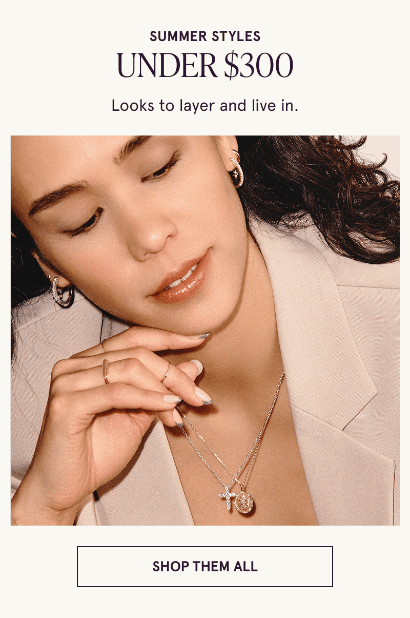 A model wearing gold diamond jewelry. Summer styles under $300. Looks to layer and live in. Click here to shop them all