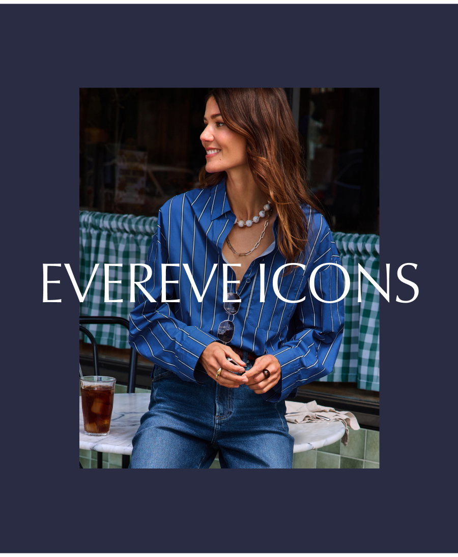 EVEREVE Icons. Image of model looking stylis in classic button down and denim outside of a cafe. 