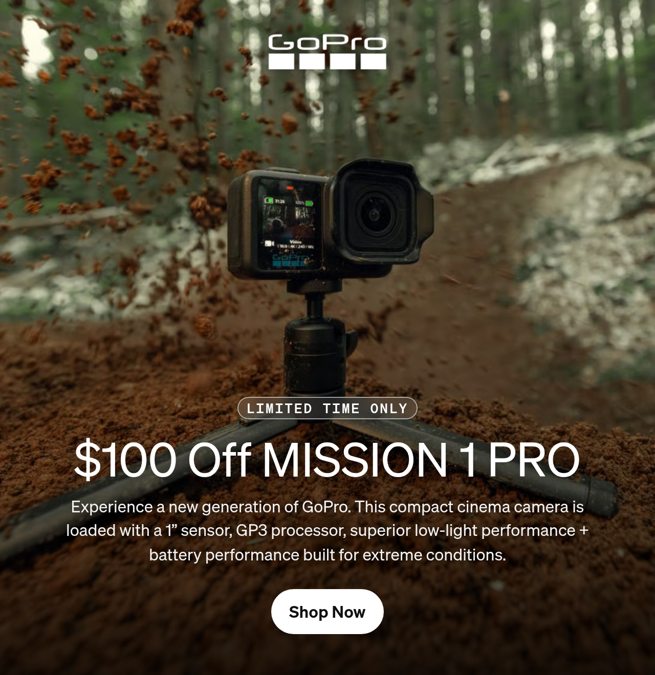 GoPro camera on a tripod capturing dirt spraying on a forest trail.