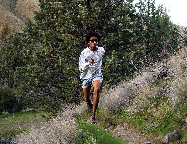 A runner on a grassy trail.