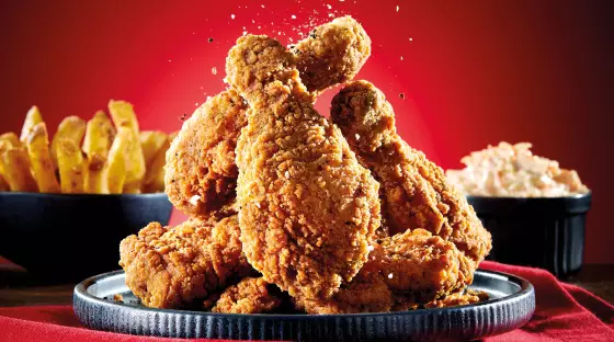 Southern fried chicken thighs and drums image