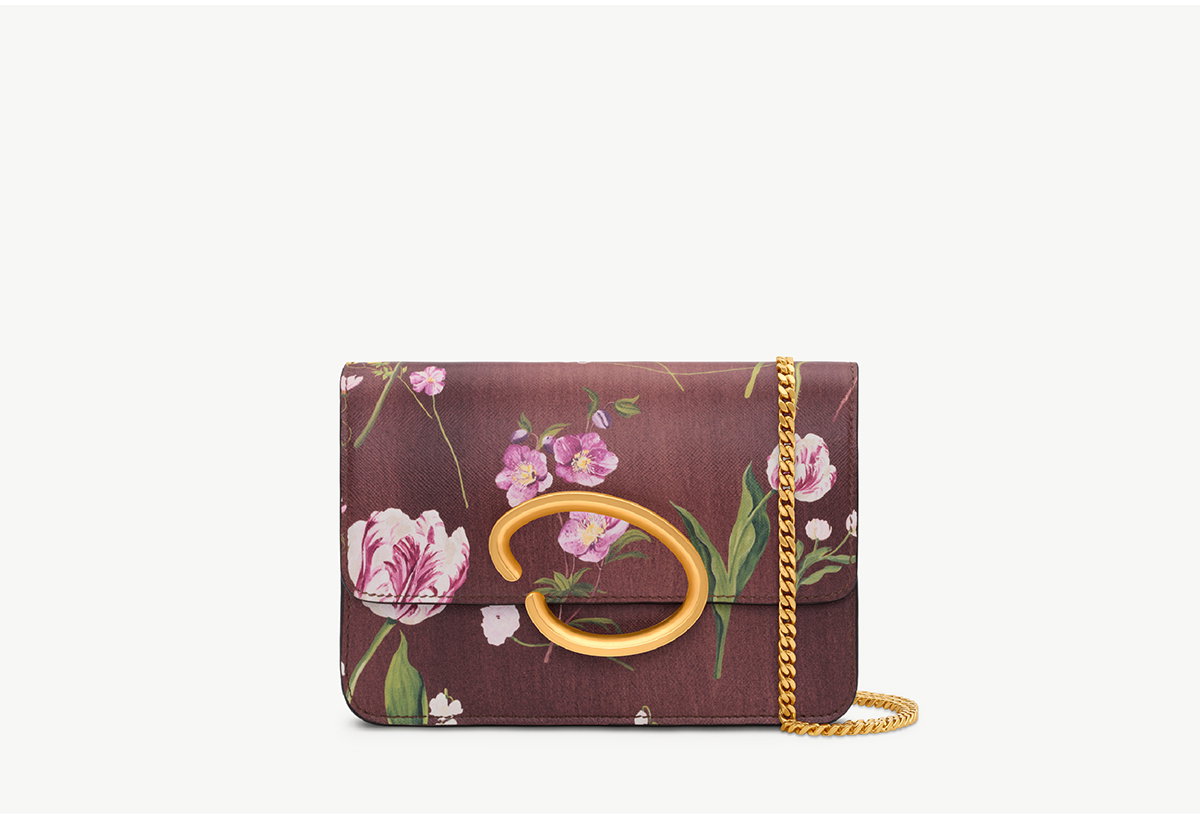 Open media 1 in gallery view The Mixed Botanical Printed O Pochette in the color brown. Front view. Open media 2 in gallery view The Mixed Botanical Printed O Pochette in the color brown. Back view. Open media 3 in gallery view The Mixed Botanical Printed O Pochette in the color brown. Front view. Open media 4 in gallery view The Mixed Botanical Printed O Pochette in the color brown. Back view. Open media 5 in gallery view The Mixed Botanical Printed O Pochette in the color brown. Front view. Open media 6 in gallery view Mixed Botanical Printed O Pochette