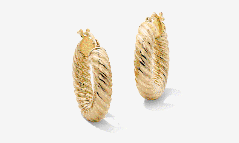 Yellow gold twist hoop earrings. Black link bracelet. Yellow gold star and diamonds pendant necklace. 