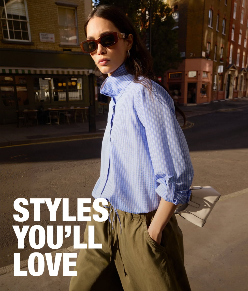 Model wearing a brown co-ord set with loose trousers and an off-shoulder top, styled with sandals, bangles, and a headscarf, sitting on a pouffe with “25% Off Your Personalised Edit” promotional text.