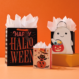 Three Halloween gift bags with tissue.