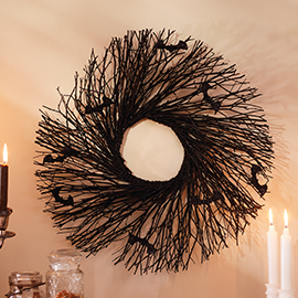 Bats in black wood wreath.