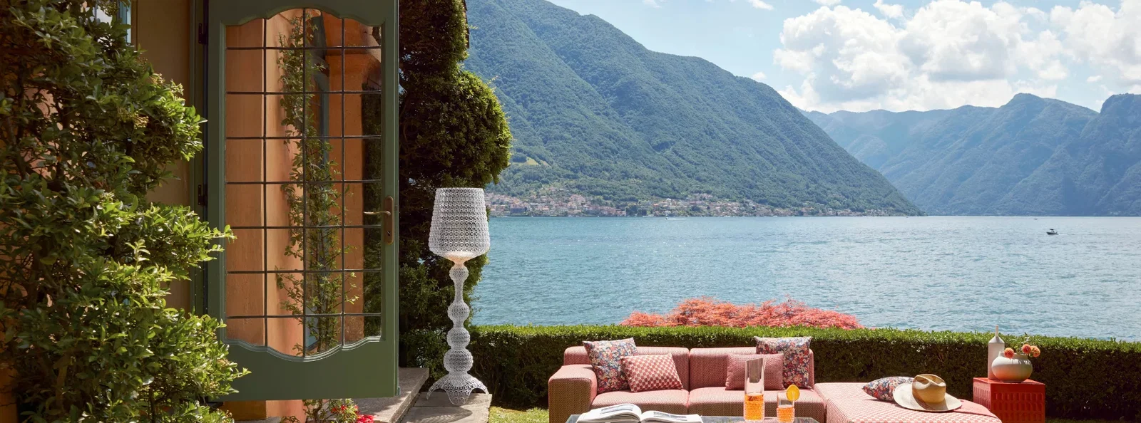 Kartell Kabuki lamps on a summer terrace overlooking the lake
